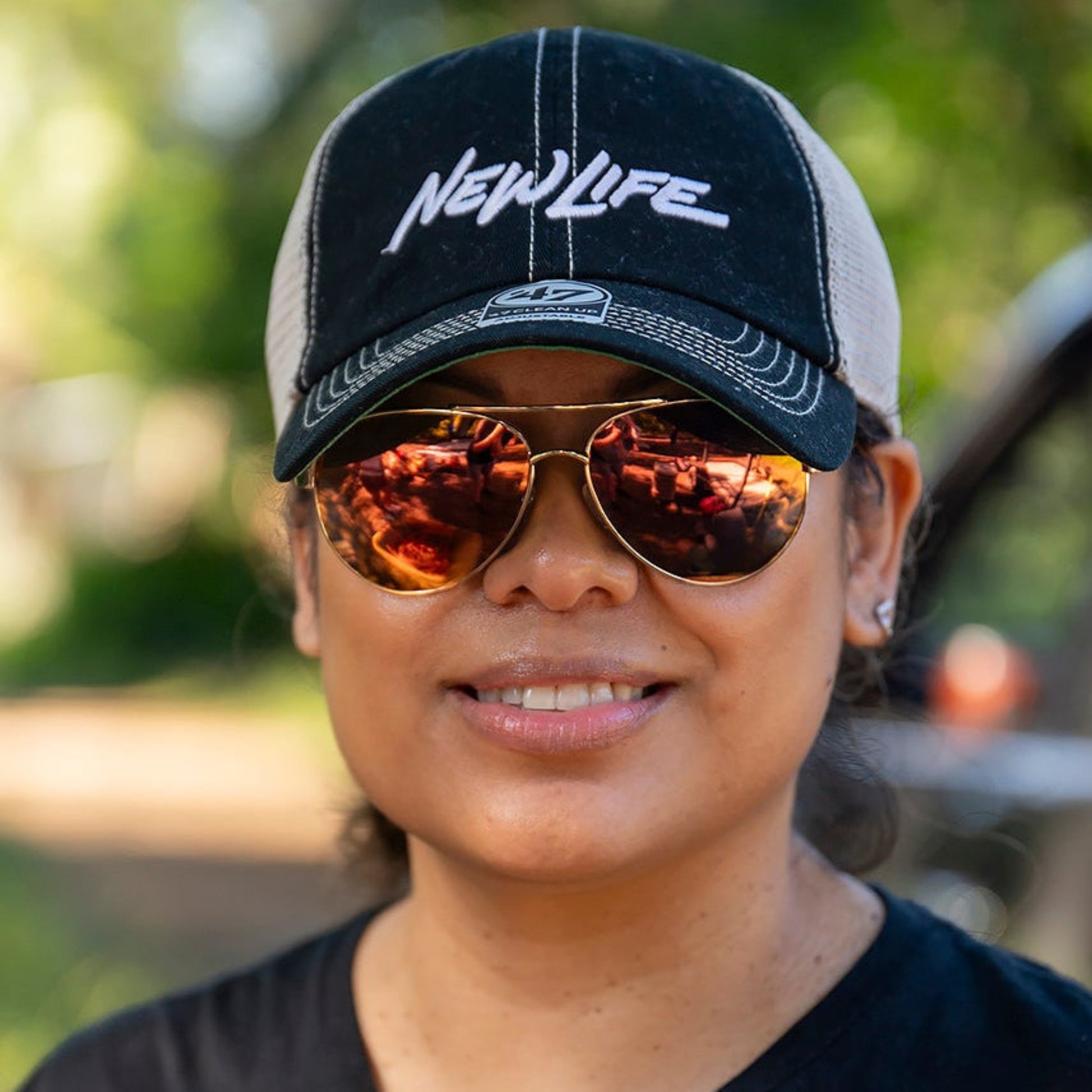lady smiling and wearing HEY CHAMA Polarized Sunglasses-Hook sunglasses