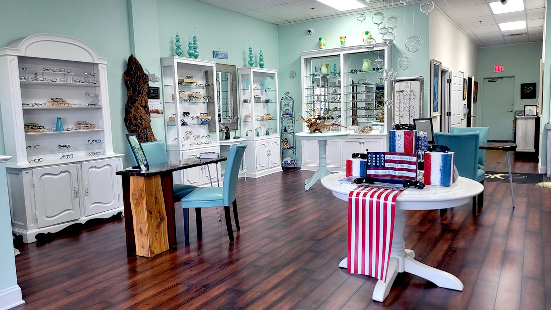 Interior of an optical galleris store with shelves, tables, and chairs, featuring American flag decor.